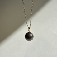 Pendant with natural pearl on a chain